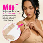 Woman adjusting a beige compression bra with wide adjustable straps on a beige background